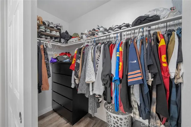 a view of a closet with storage