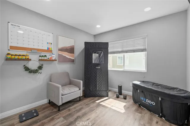 a bedroom with furniture and a window