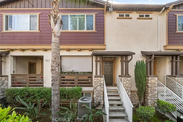 a front view of a house with stairs