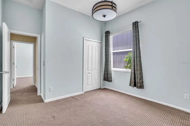 an empty room with a empty space and windows