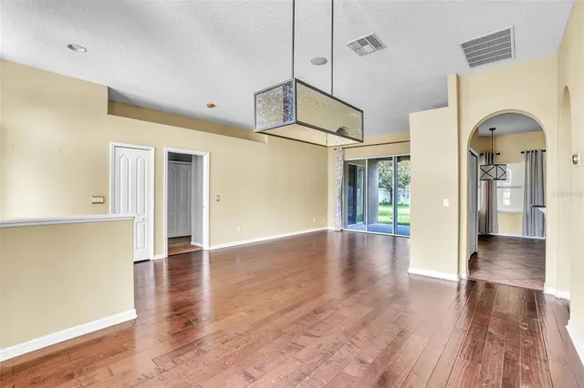 a view of livingroom with hardwood floor and a ceiling fan