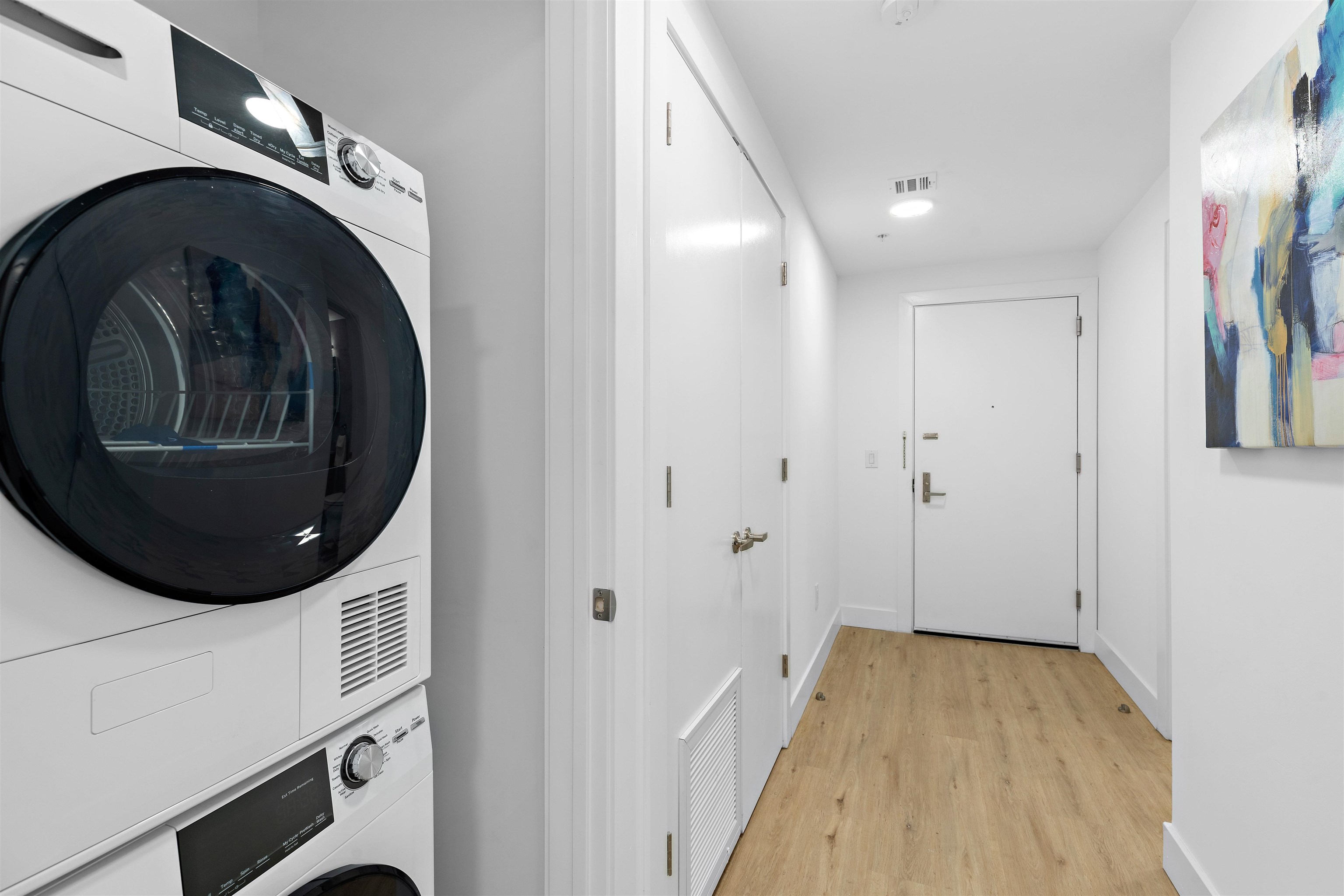 231 Hackensack Plank Road, Unit 508 Weehawken, NJ 07086 - Photo 4 of 7 a view of a hallway with washer and dryer