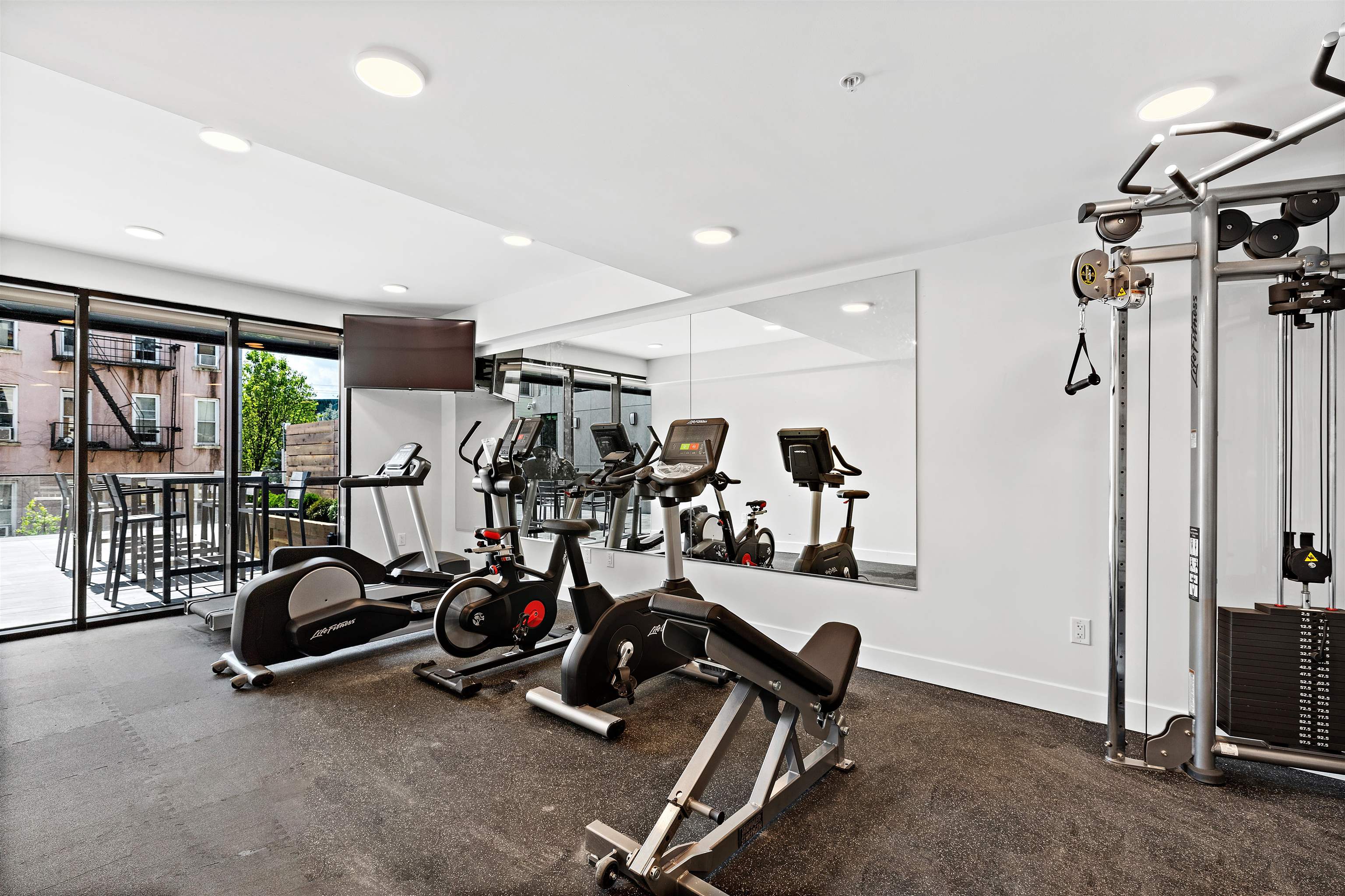 231 Hackensack Plank Road, Unit 508 Weehawken, NJ 07086 - Photo 6 of 7 a view of a room with gym equipment