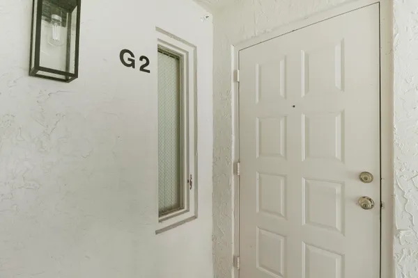 a bathroom with a shower and a mirror