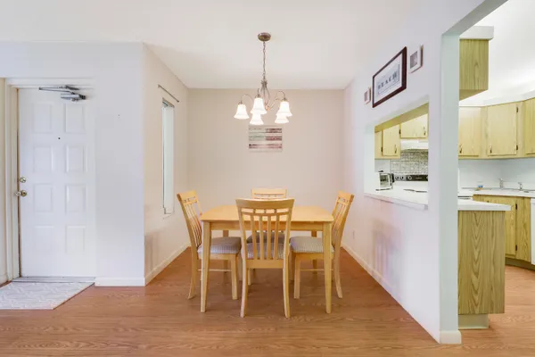 a view of a dining room with furniture window and wooden floor