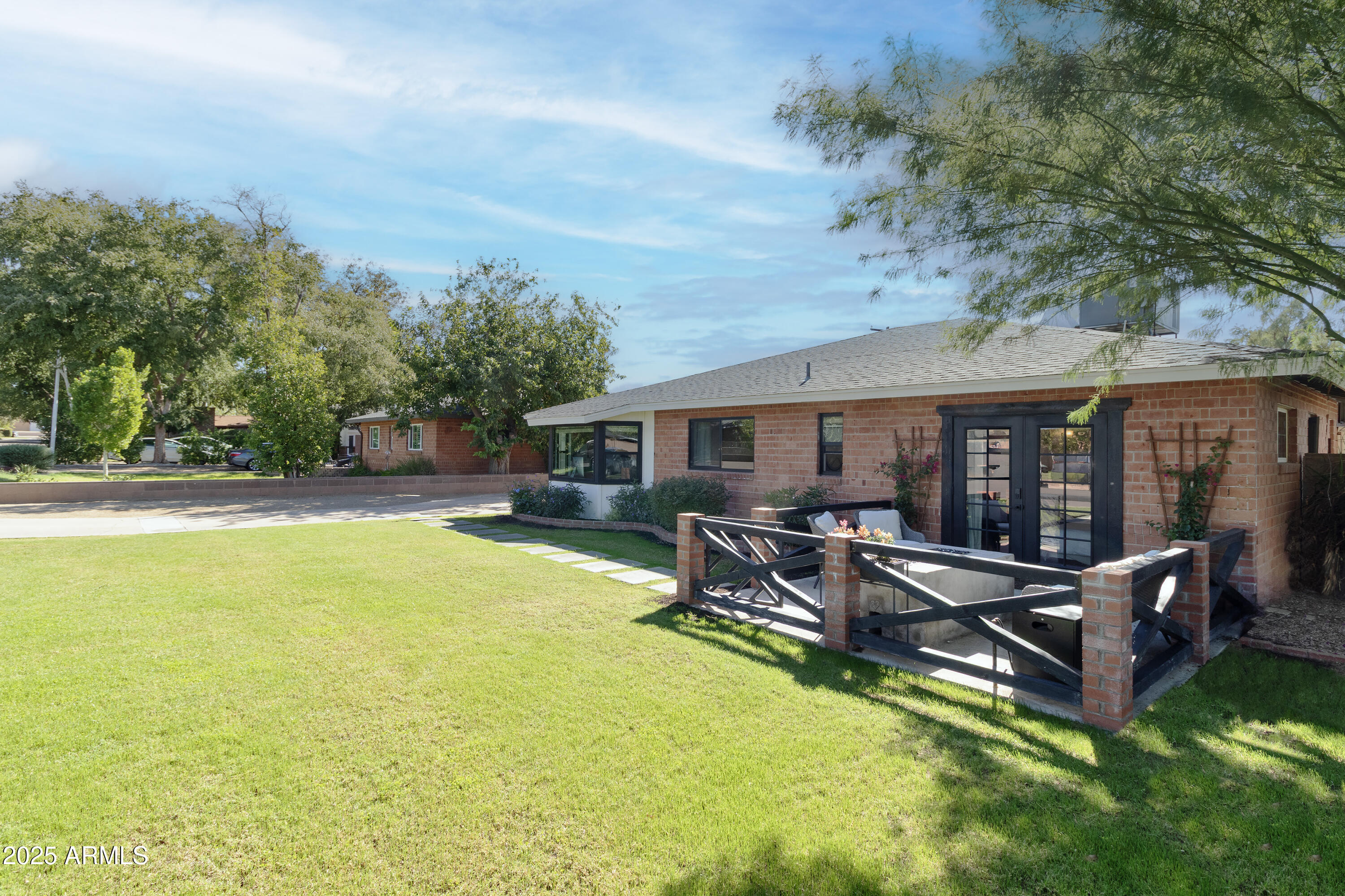 a view of a house with swimming pool and sitting area