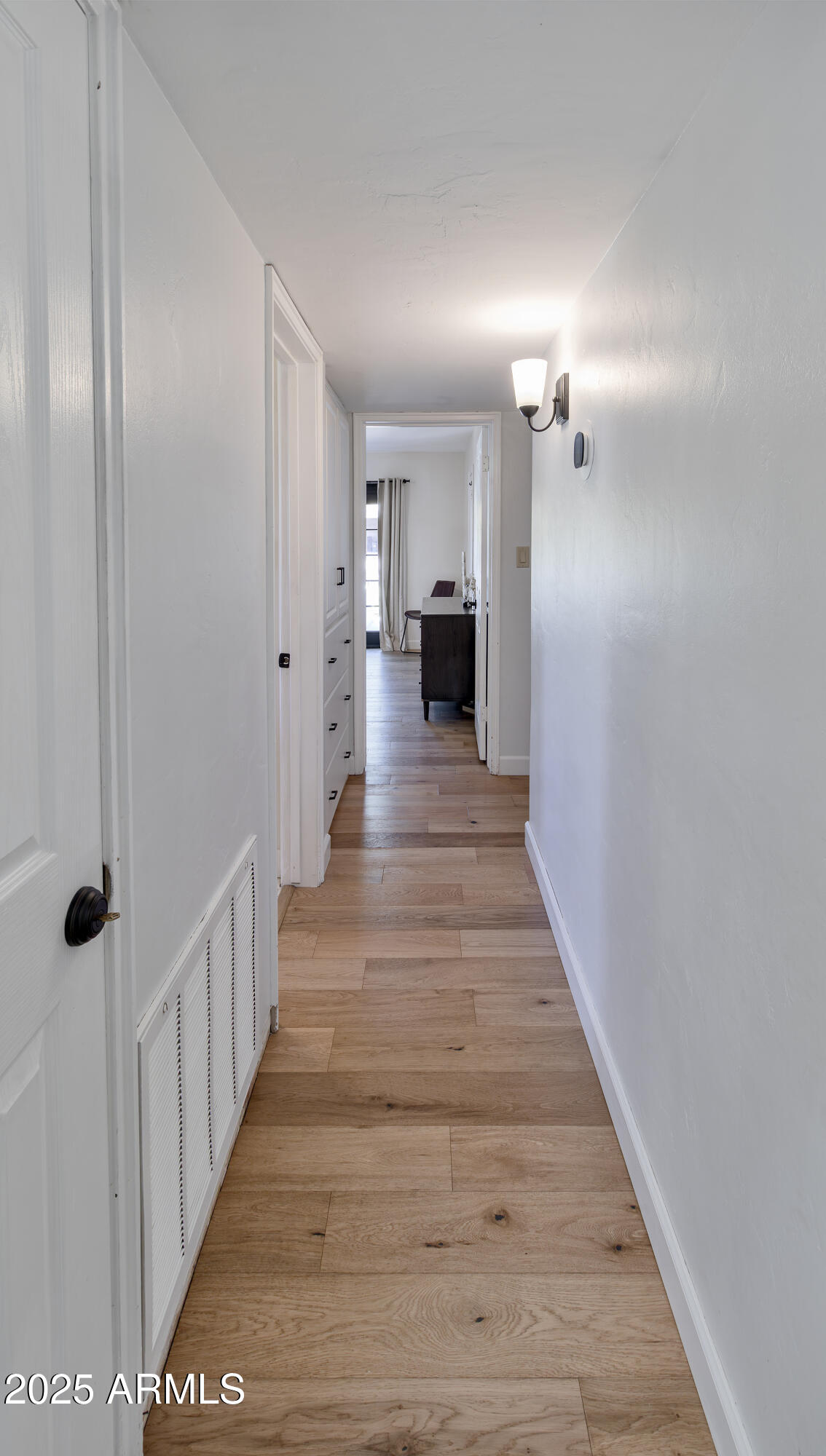 1903 East Palo Verde Drive Phoenix, AZ 85016 - Photo 11 of 25 a view of a hallway with wooden floor