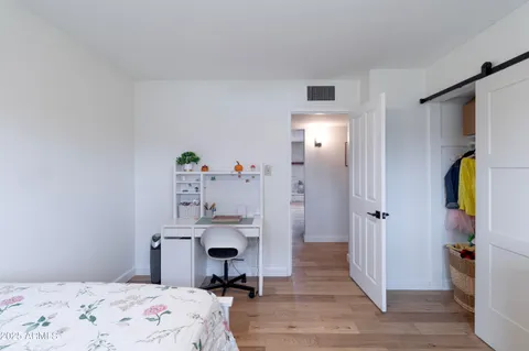 a bathroom with a sink toilet and mirror
