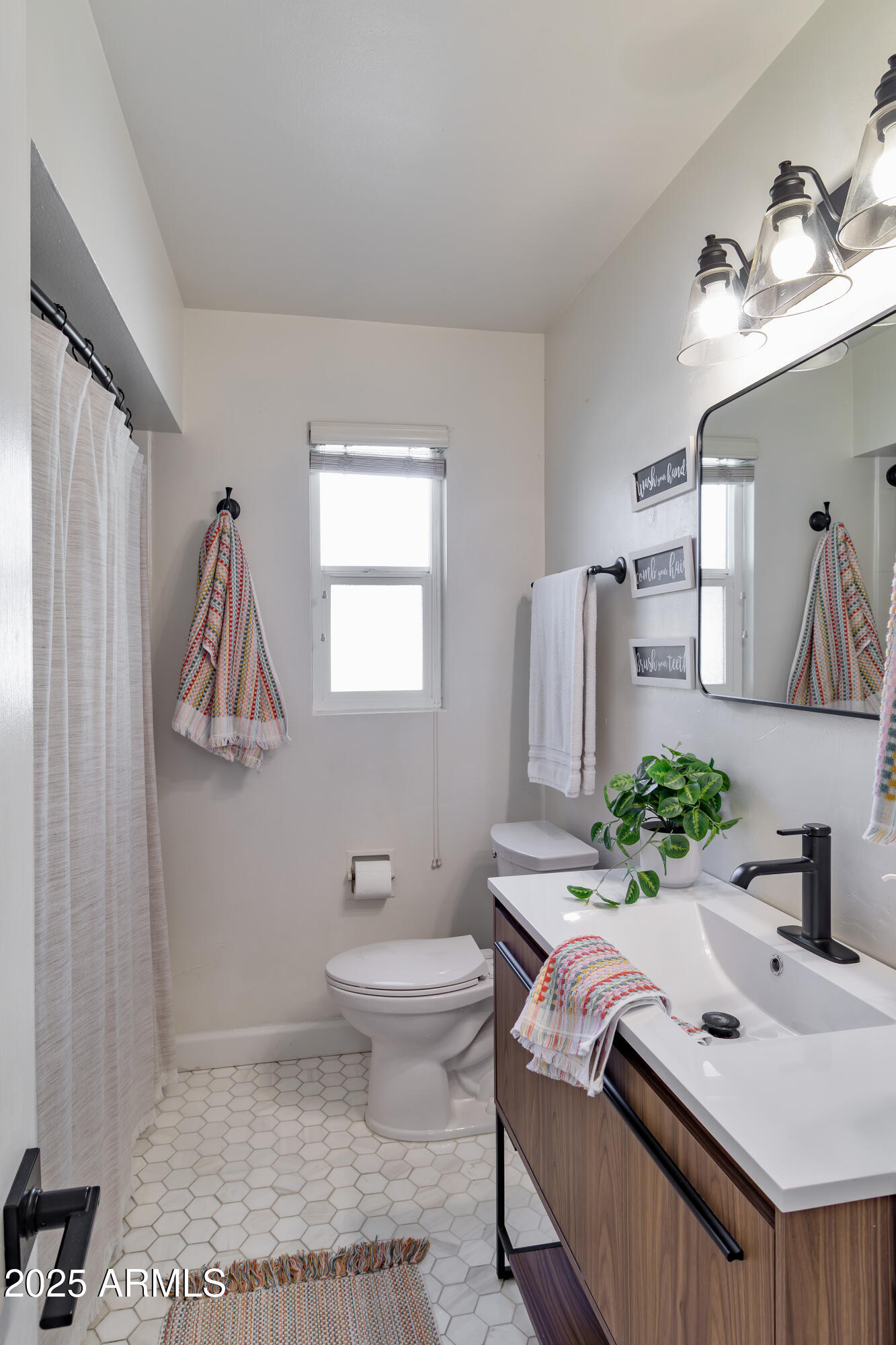 1903 East Palo Verde Drive Phoenix, AZ 85016 - Photo 18 of 25 a bathroom with a sink toilet and mirror
