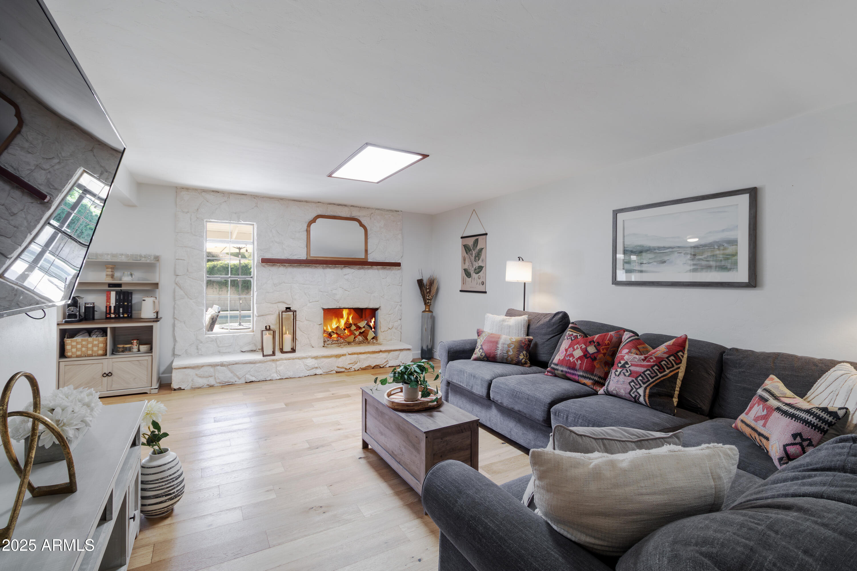 1903 East Palo Verde Drive Phoenix, AZ 85016 - Photo 3 of 25 a living room with furniture and a fireplace