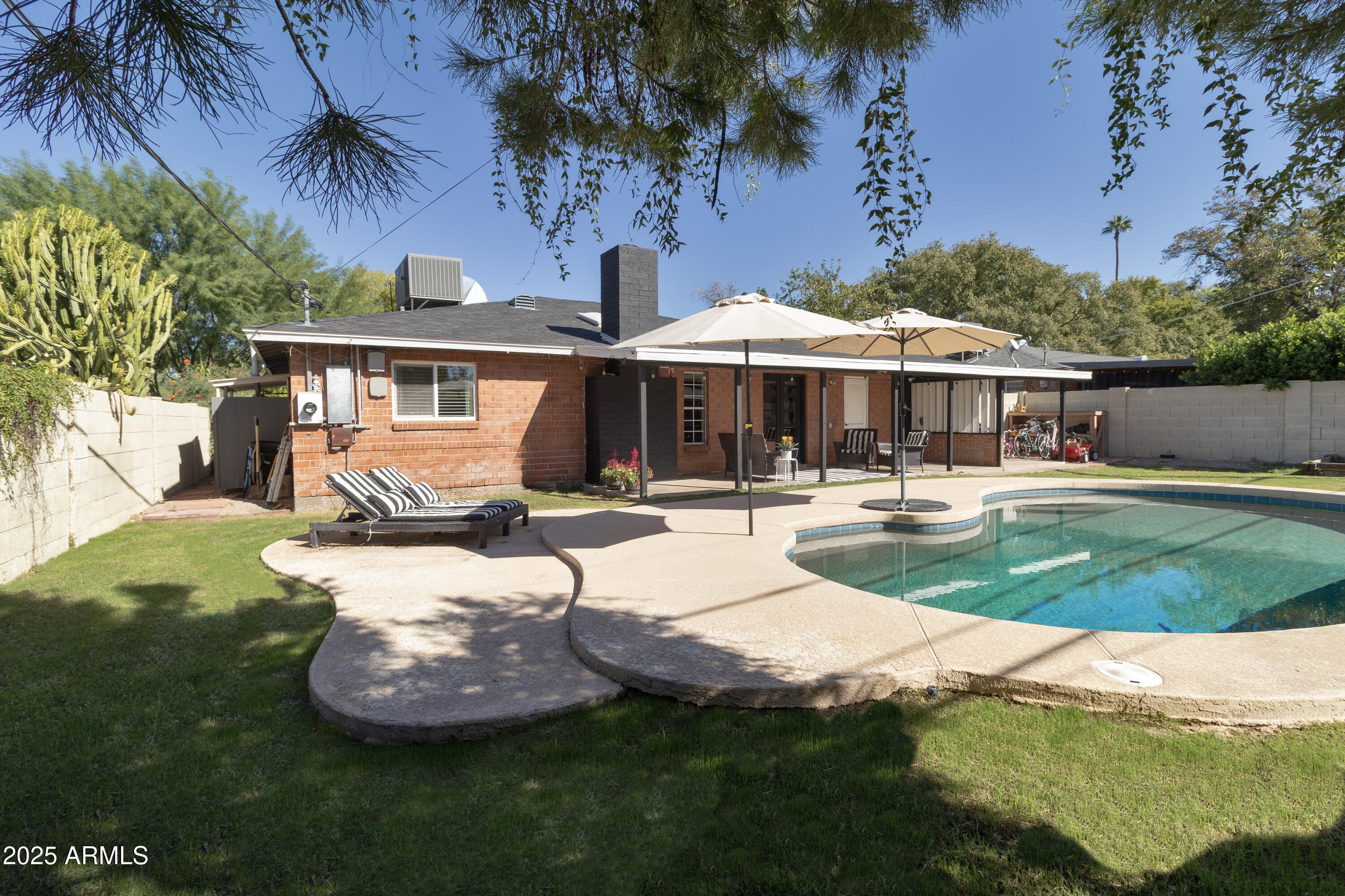 1903 East Palo Verde Drive Phoenix, AZ 85016 - Photo 5 of 25 a front view of a house with garden and trees