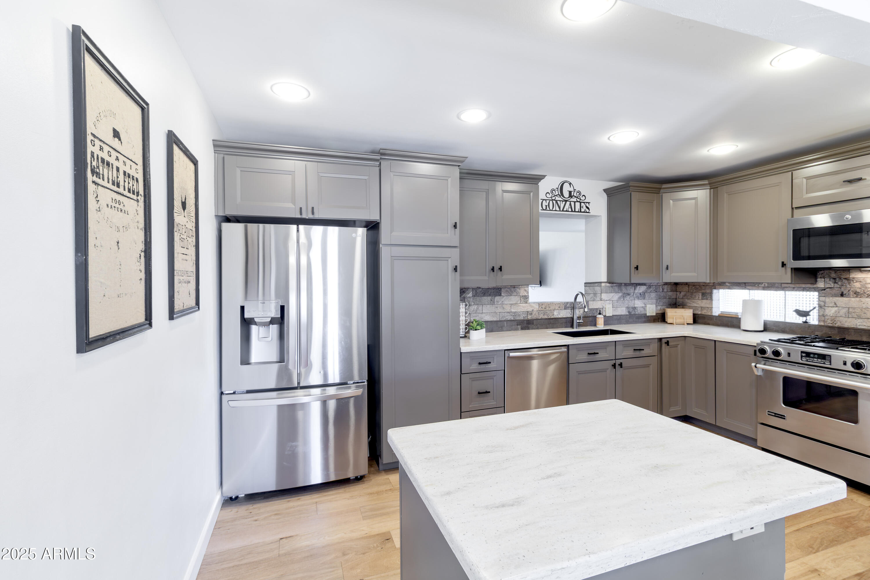 1903 East Palo Verde Drive Phoenix, AZ 85016 - Photo 6 of 25 a kitchen with granite countertop stainless steel appliances and refrigerator