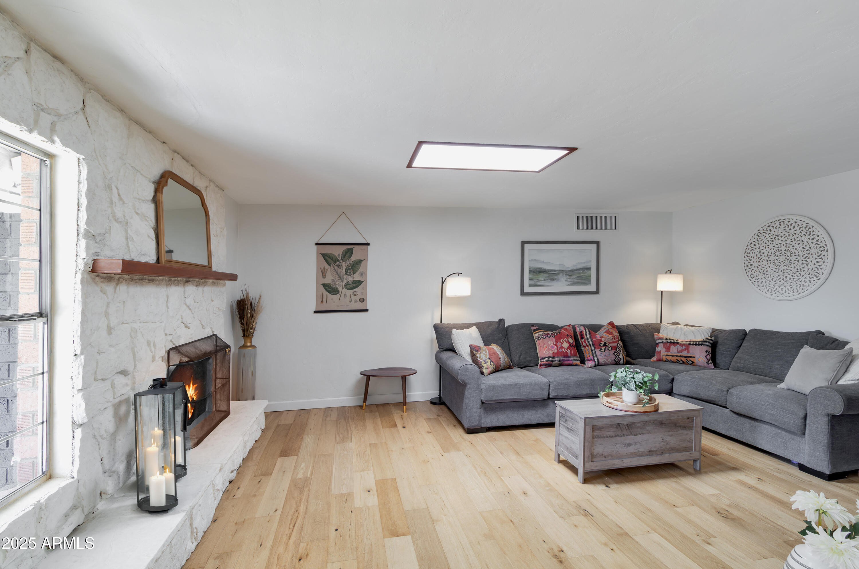 1903 East Palo Verde Drive Phoenix, AZ 85016 - Photo 9 of 25 a living room with furniture and a fireplace