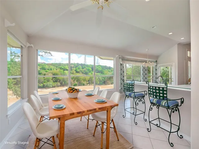 a view of a dining room with furniture window and outside view