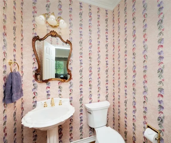 a bedroom with a large bed and a large window