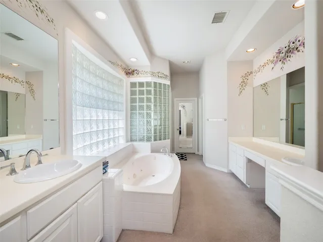 a bathroom with a bathtub and a sink