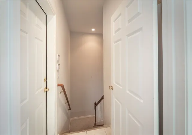 a room with pool table and windows