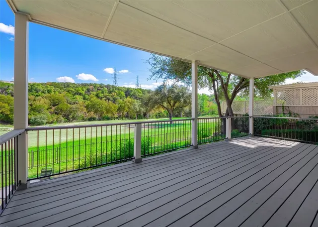 a view of a backyard with swimming pool