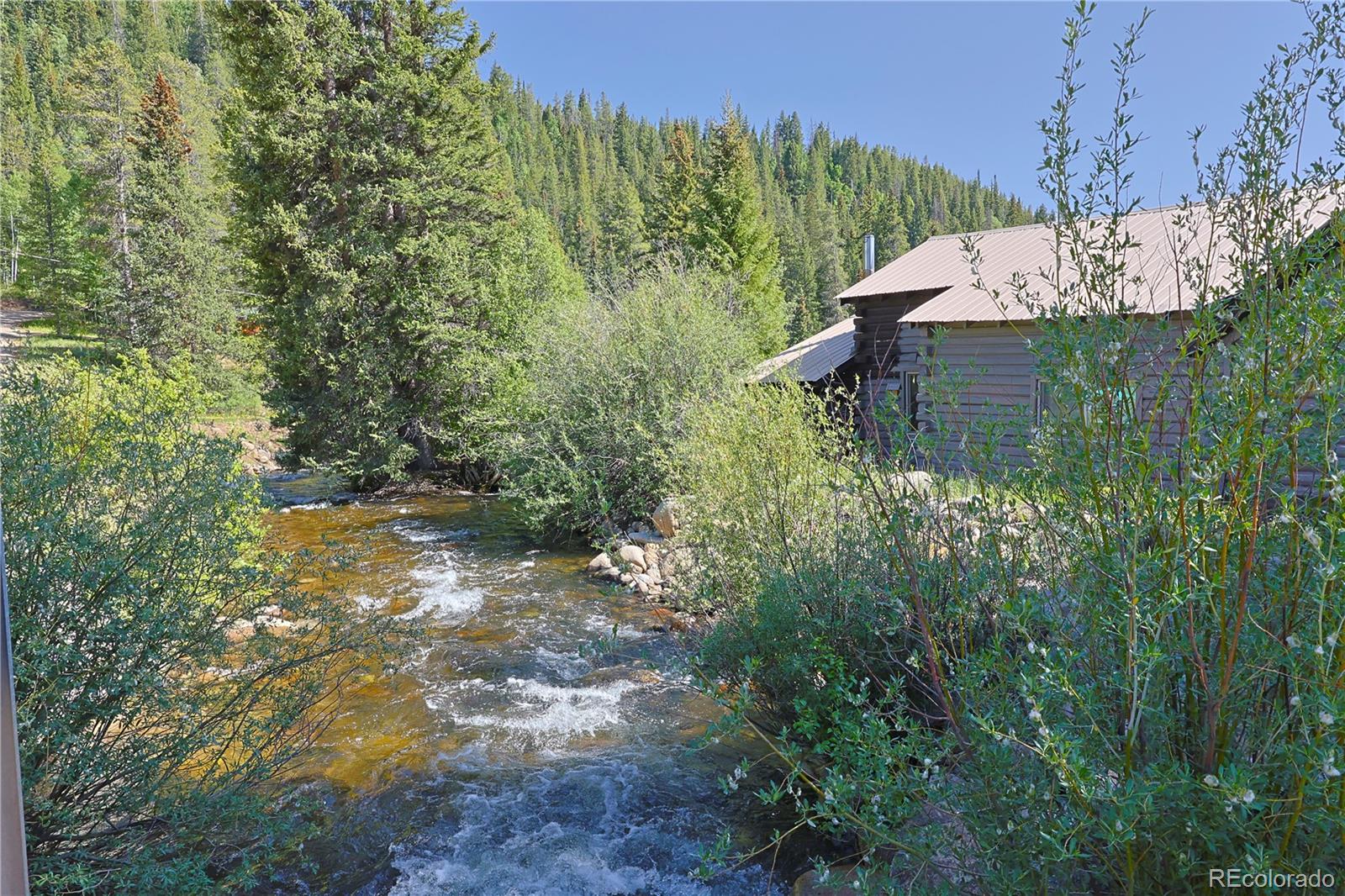 a view of a garden with a house