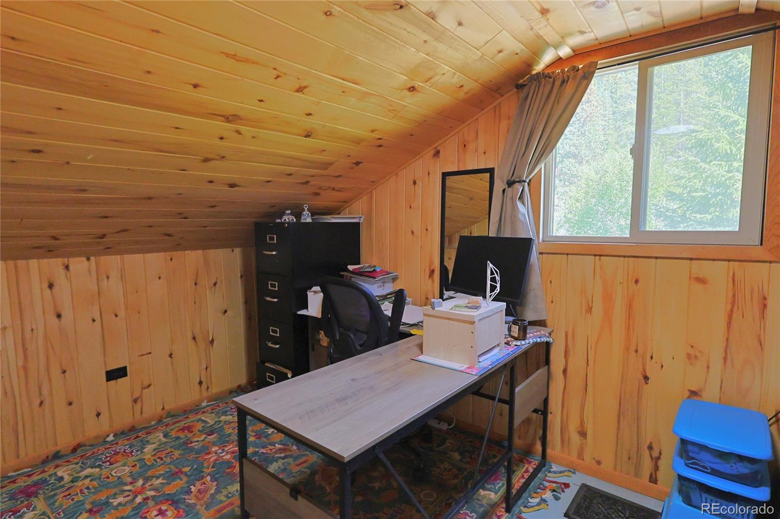 420 Quartz Lane Pitkin, CO 81241 - Photo 17 of 40 a view of a workspace with furniture and wooden floor