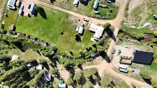 an aerial view of house with yard