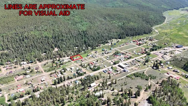 a street sign is sitting on a open field