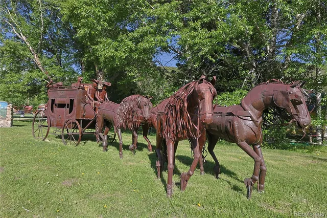a view of an house with backyard and outdoor seating