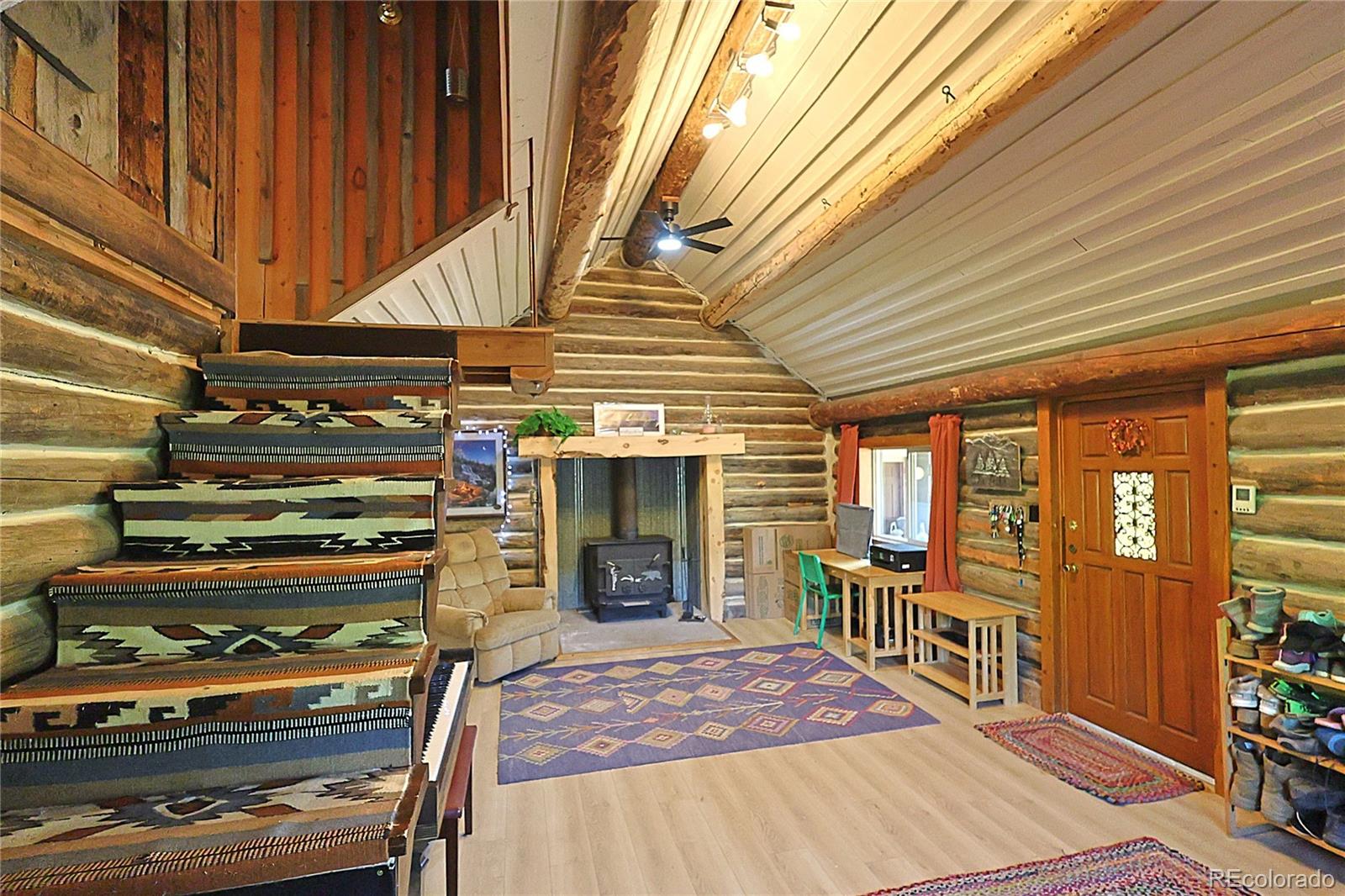 420 Quartz Lane Pitkin, CO 81241 - Photo 8 of 40 a view of a chairs and table in a patio