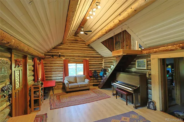a balcony with furniture and a potted plant