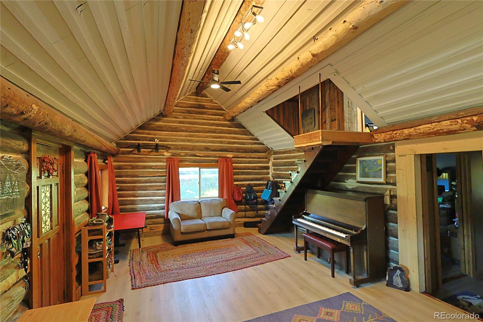 420 Quartz Lane Pitkin, CO 81241 - Photo 9 of 40 a balcony with furniture and a potted plant