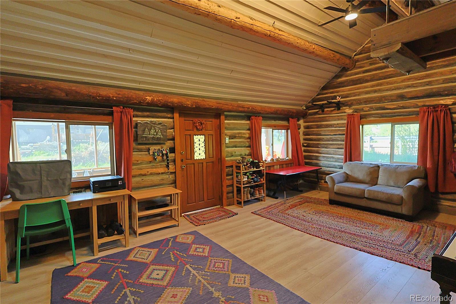 420 Quartz Lane Pitkin, CO 81241 - Photo 10 of 40 a living room with furniture a rug and a table