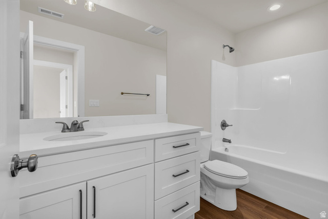 578 West 7th Midvale, UT 84047 - Photo 19 of 35 Full bathroom featuring shower / tub combination, vanity, and dark wood finished floors