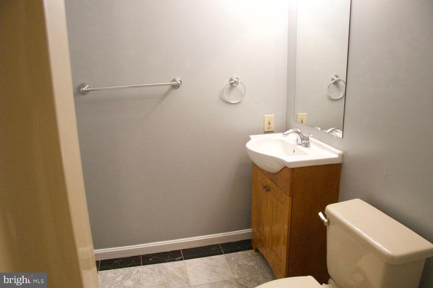 1831 Tilletson Place Woodbridge, VA 22191 - Photo 12 of 18 a bathroom with a sink toilet and vanity