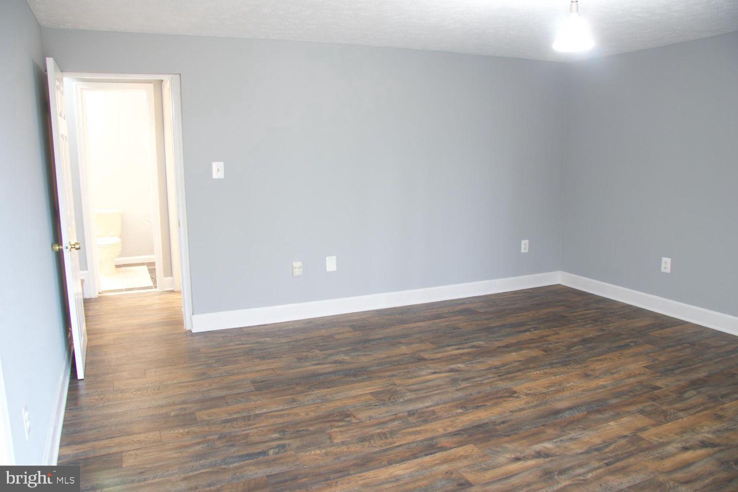 1831 Tilletson Place Woodbridge, VA 22191 - Photo 4 of 18 a view of an empty room and wooden floor