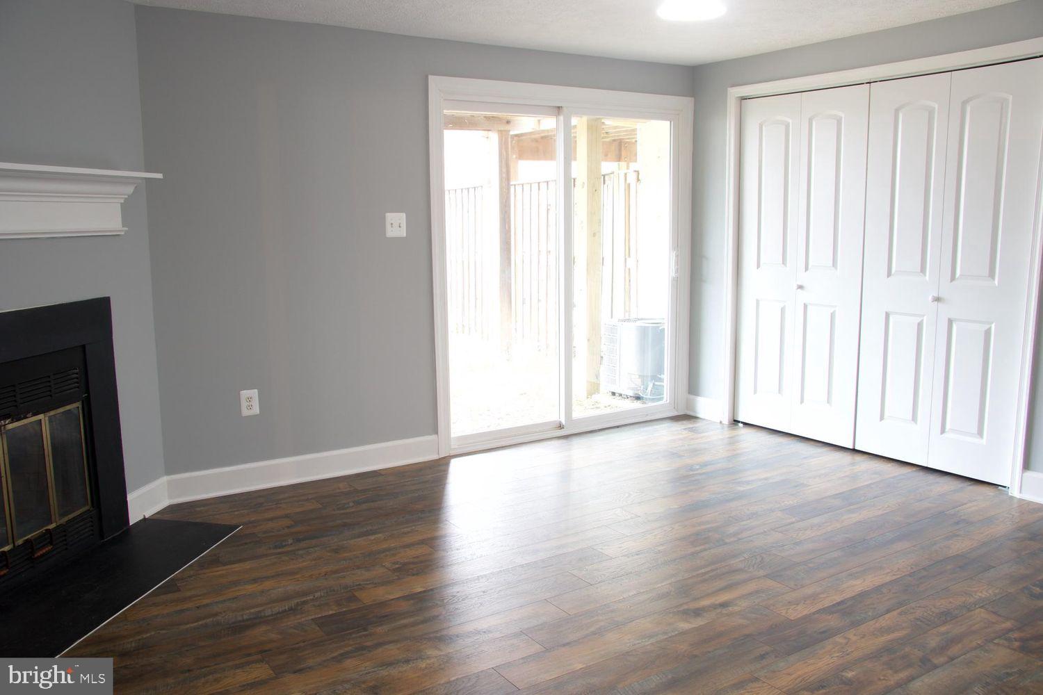 1831 Tilletson Place Woodbridge, VA 22191 - Photo 5 of 18 a view of an empty room with wooden floor and a window