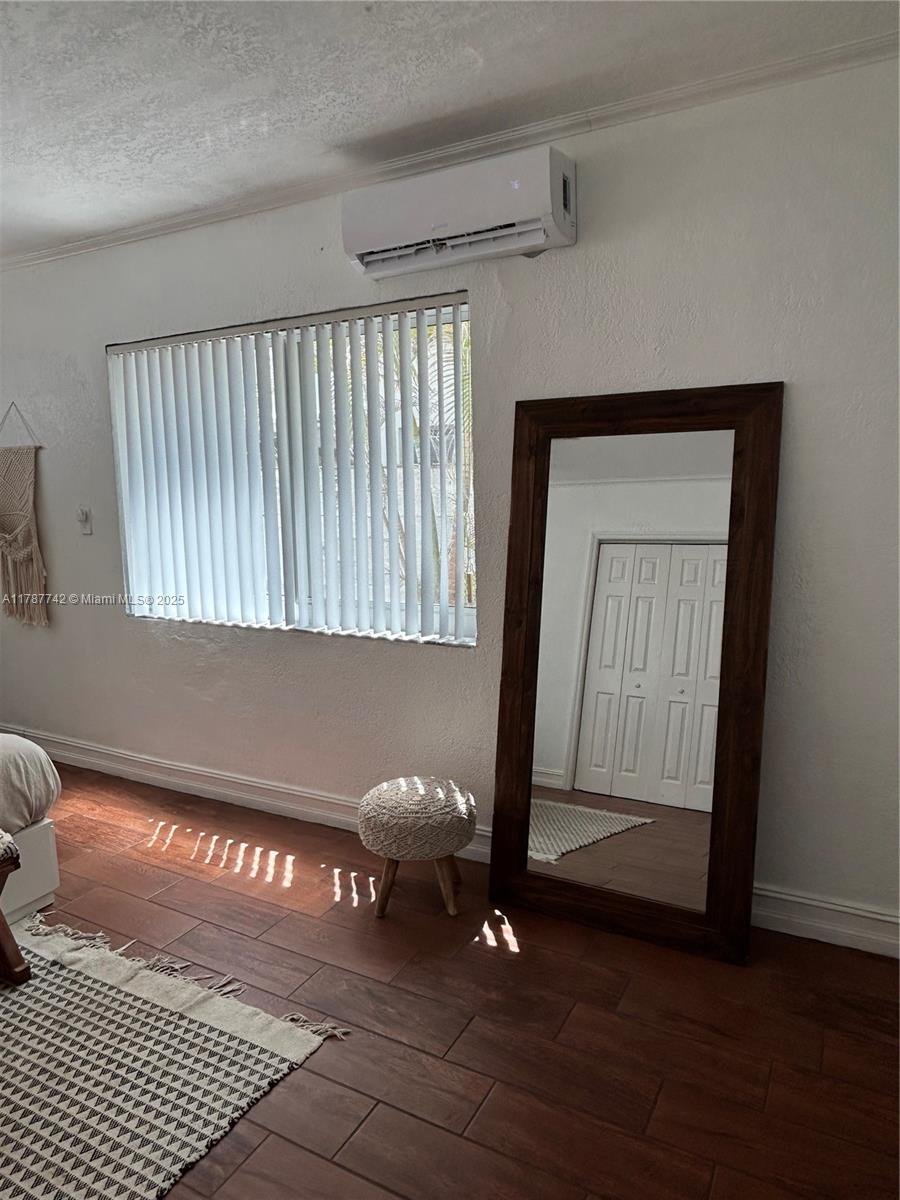 316 Walnut Street, Unit 1 Hollywood, FL 33019 - Photo 11 of 15 a view of an empty room with wooden floor