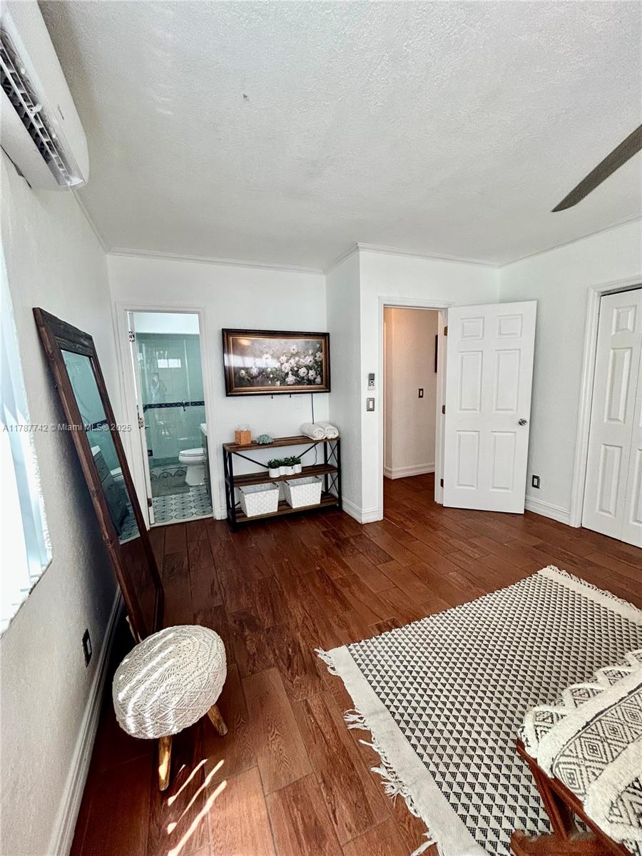 316 Walnut Street, Unit 1 Hollywood, FL 33019 - Photo 9 of 15 a living room with furniture and a chair