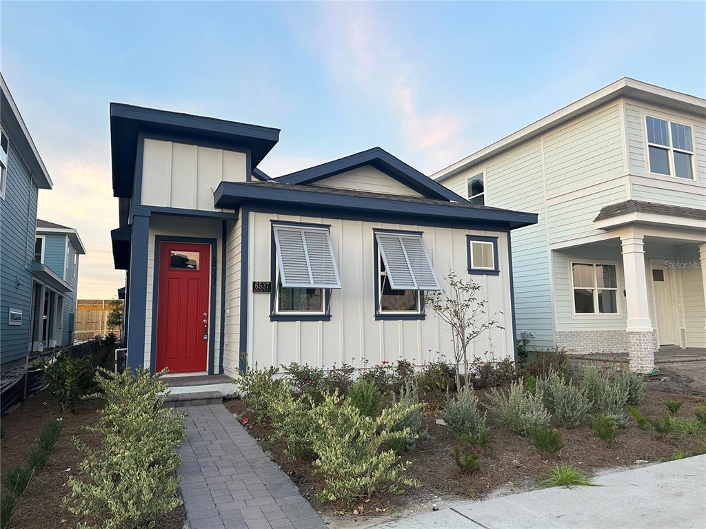 6537 Rover Way St. Cloud, FL 34771 - Photo 1 of 1 a front view of a house with garden