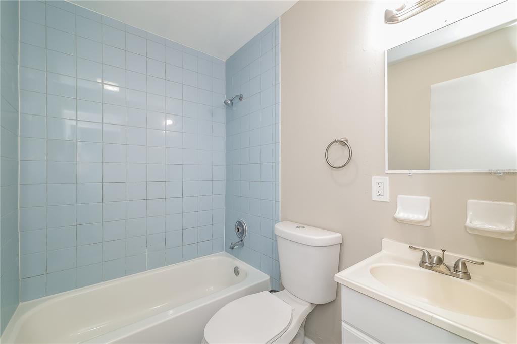 4243 Cynthia Street Orlando, FL 32811 - Photo 13 of 16 a bathroom with a sink a toilet and shower