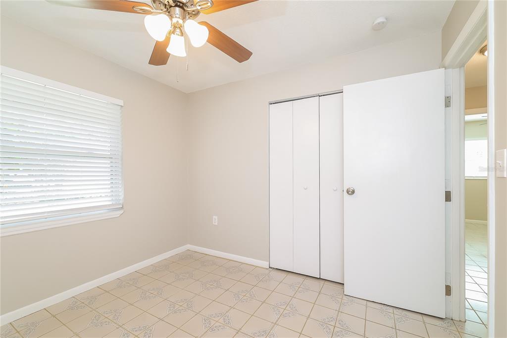 4243 Cynthia Street Orlando, FL 32811 - Photo 9 of 16 a view of an empty room with window chandelier fan