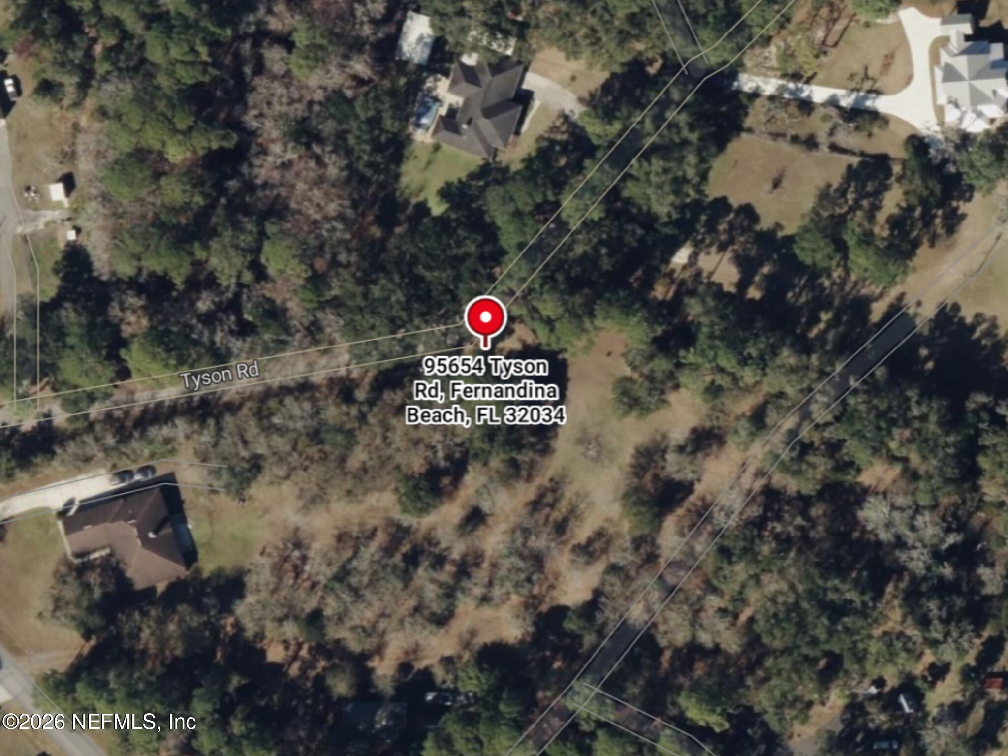 95654 Tyson Road Fernandina Beach, FL 32034 - Photo 15 of 16 a sign that is on a tree