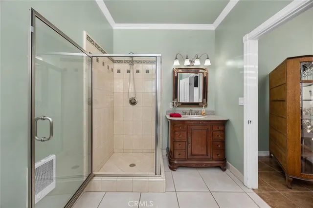 a spacious bathroom with a granite countertop sink and a mirror