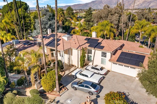 a view of a street with cars parked