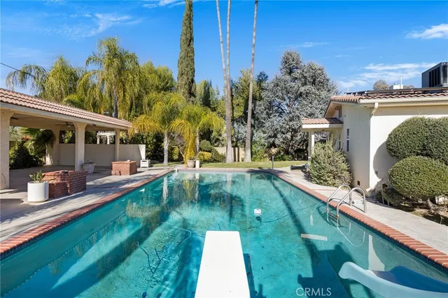 a view of a house with swimming pool