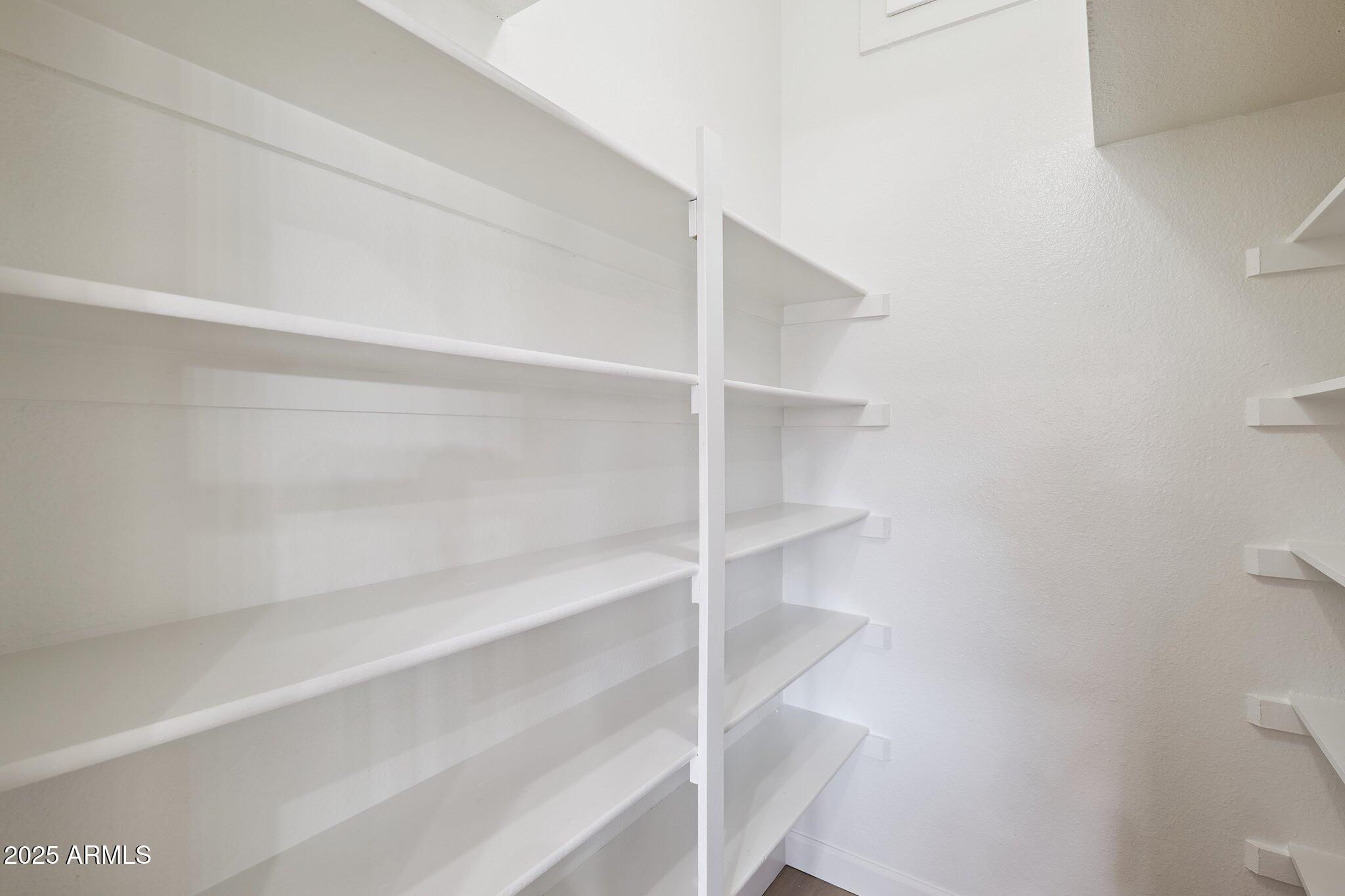 15 East Kathleen Road Phoenix, AZ 85022 - Photo 14 of 40 a view of walk in closet with empty racks