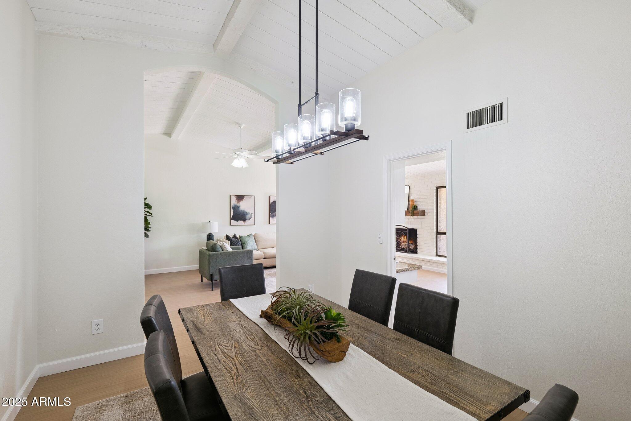 15 East Kathleen Road Phoenix, AZ 85022 - Photo 17 of 40 a view of a dining room with furniture and wooden floor
