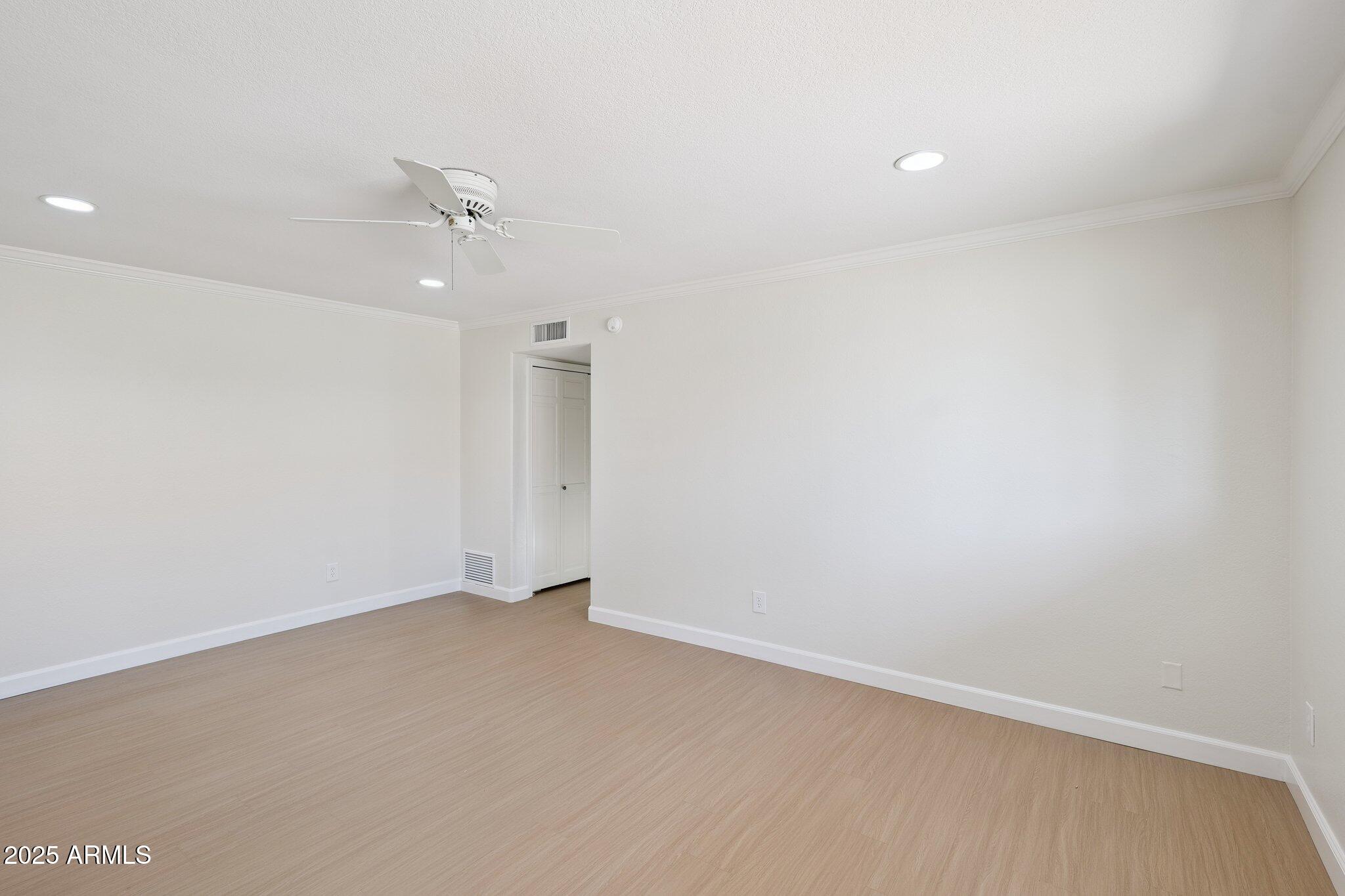 15 East Kathleen Road Phoenix, AZ 85022 - Photo 19 of 40 an empty room with a ceiling fan and a fan