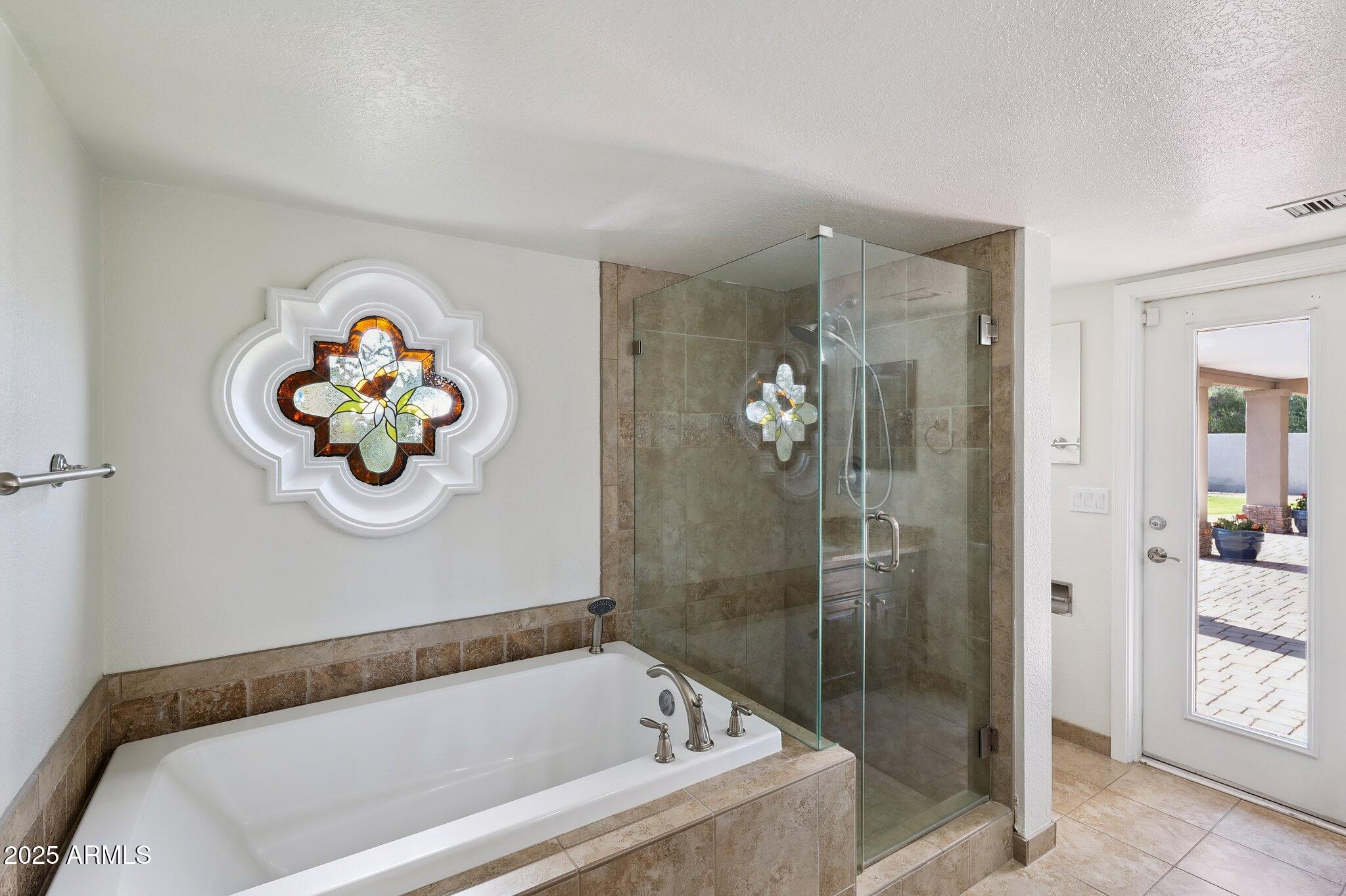 15 East Kathleen Road Phoenix, AZ 85022 - Photo 22 of 40 a bathroom with a tub and shower