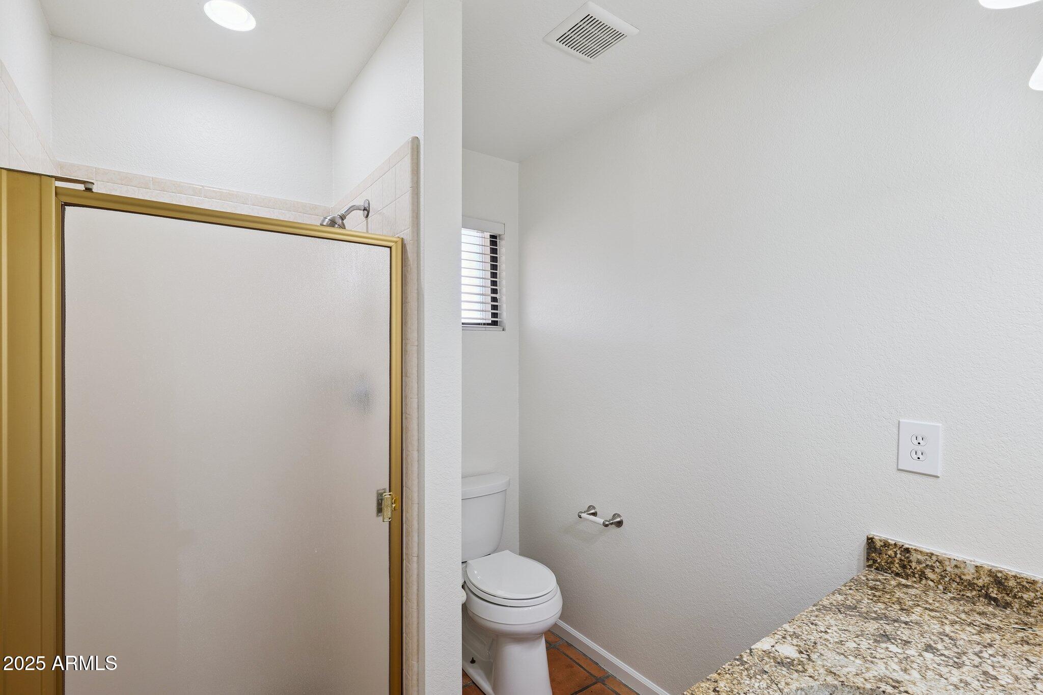 15 East Kathleen Road Phoenix, AZ 85022 - Photo 29 of 40 a bathroom with a toilet and a shower