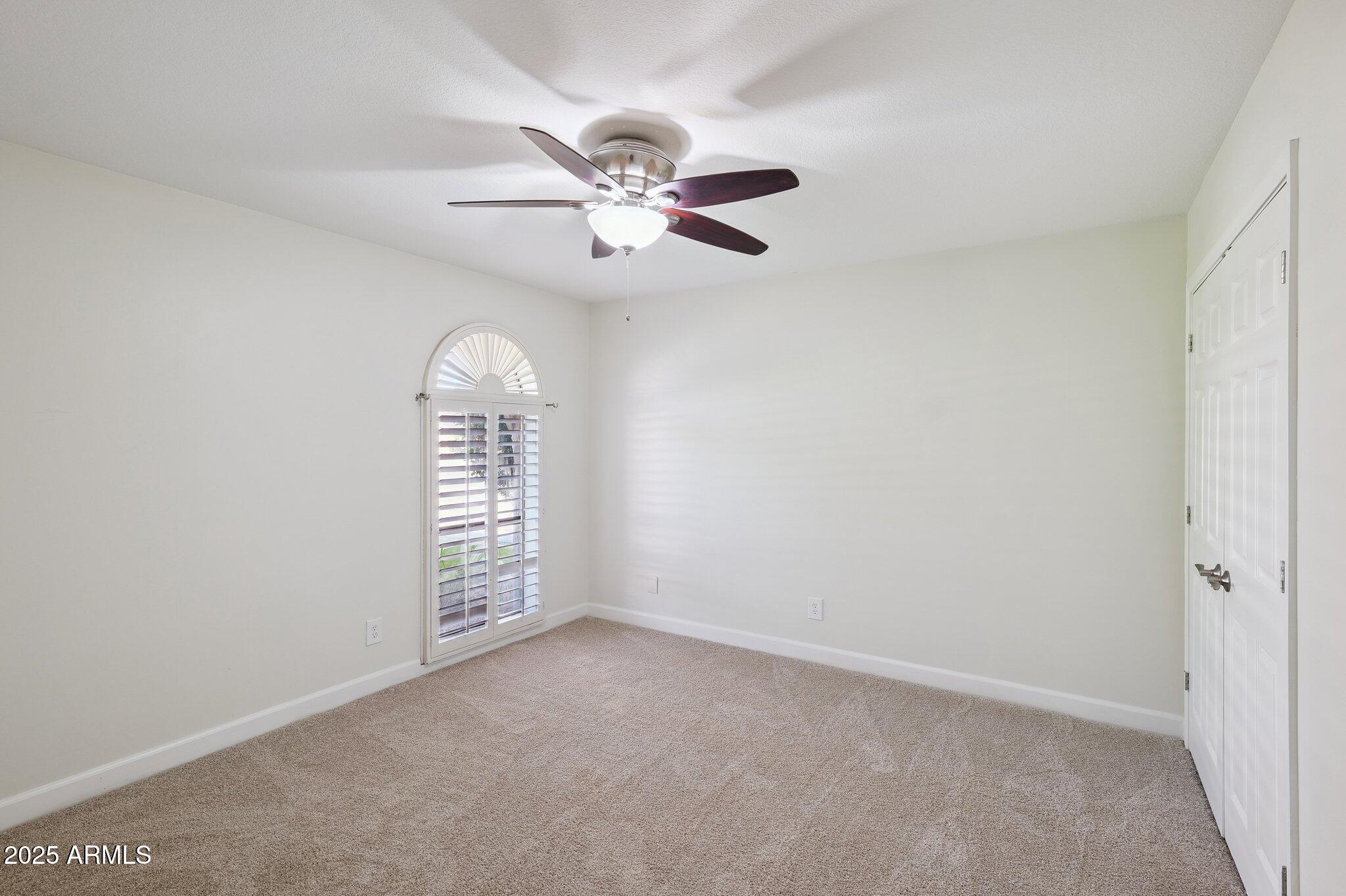 15 East Kathleen Road Phoenix, AZ 85022 - Photo 31 of 40 an empty room with windows and fan